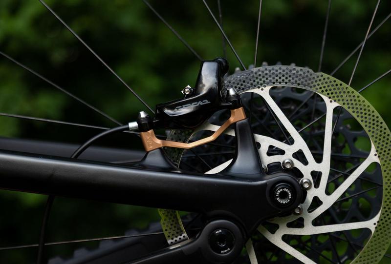 Oak Components Plasmadapt Brake Adapter, Post Mount, +23mm, Copper (incl. Titanium Mounting Hardware)