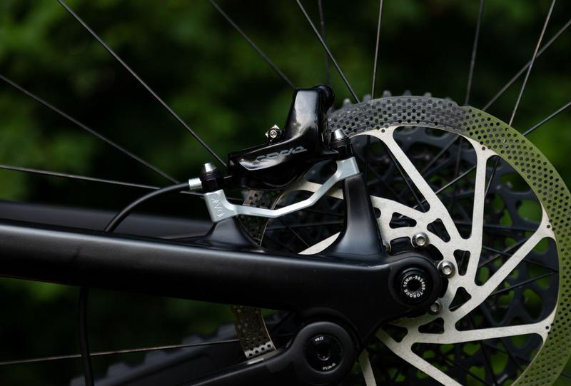 Oak Components Plasmadapt Brake Adapter, Post Mount, +23mm, Raw (incl. Titanium Mounting Hardware)